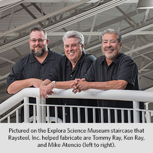 Pictured on the Explora Science Museum staircase that Raysteel, Inc. helped  fabricate are Tommy Ray, Ken Ray, and Mike Atencio (left to right).
